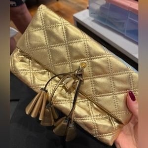 marc jacobs clutch is metallic gold color